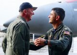 Capt. Hurst and Capt. Cimicata shake hands after landing. The two exchanged change of command while in the air.